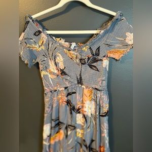 Blue floral romper. NWT never worn. Size M. Lightweight soft material